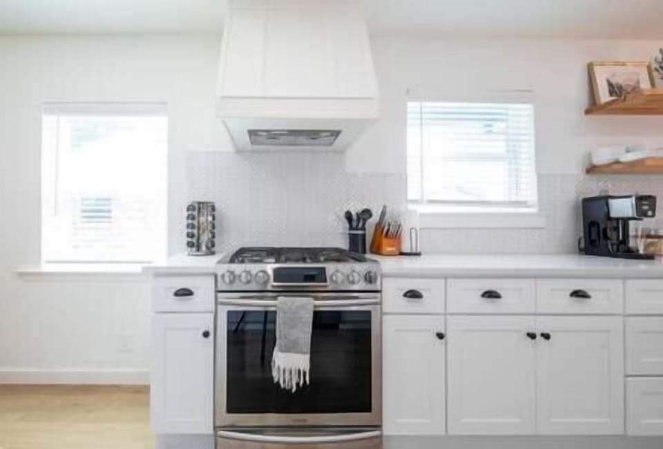 Show off your culinary skills in this modern kitchen with sleek SS appliances