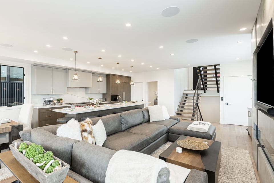 Front entry (3rd level) into the main living area with a large and cozy sectional sofa