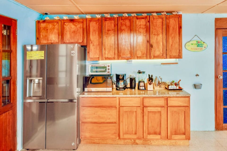 An outdoor kitchen fully equipped with all the amenities you need to prepare a delicious meal or drink.