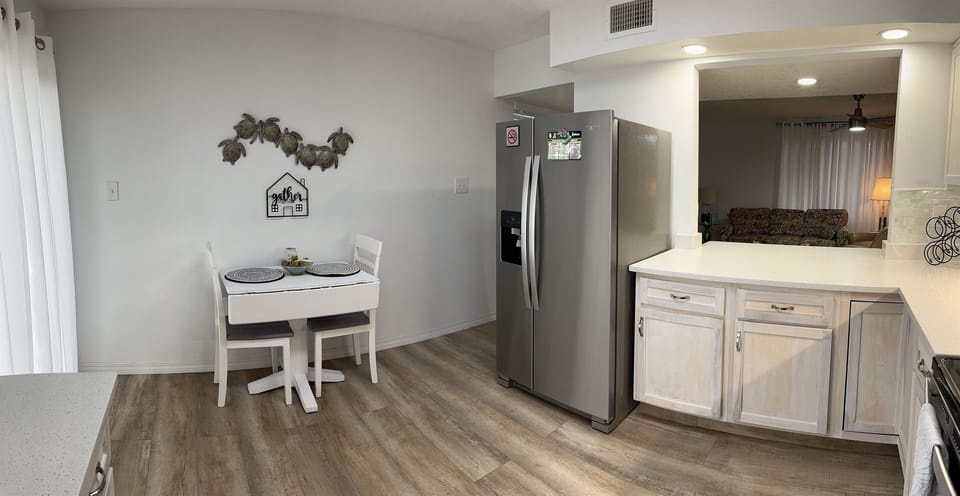 Full size refrigerator with ice maker.