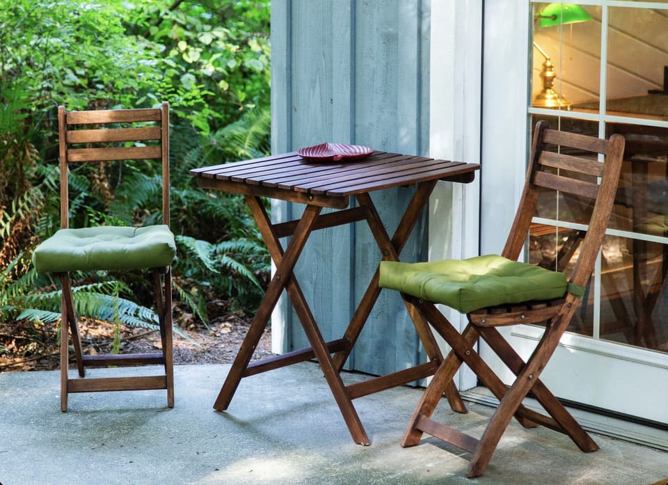 The front porch is a lovely spot for coffee in the morning.
