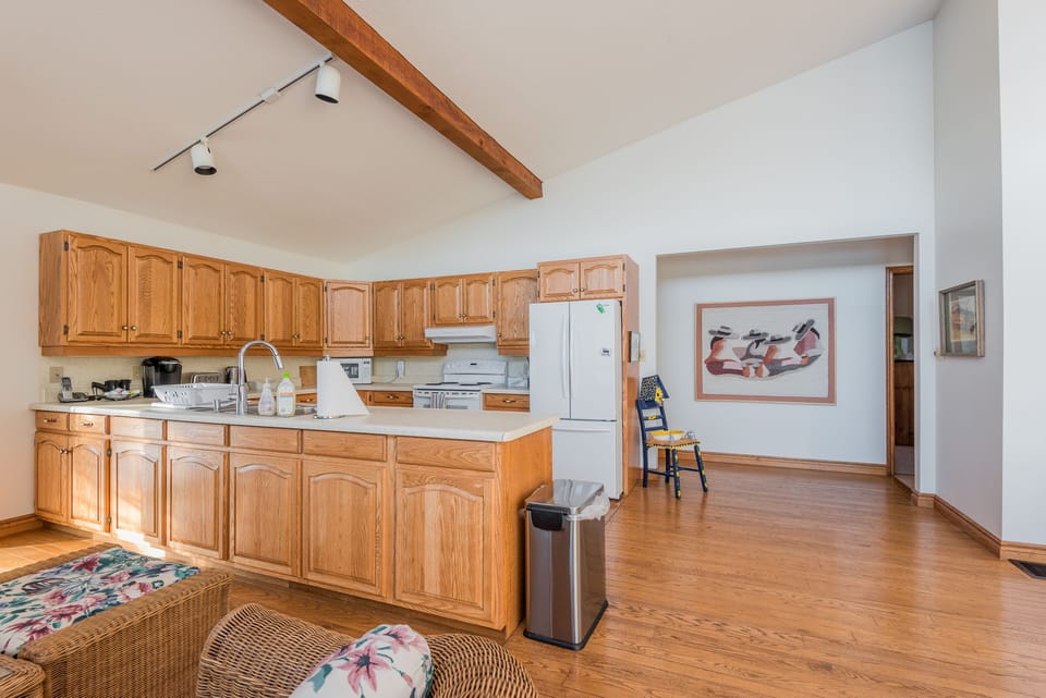 Spacious living area between kitchen, dining and living.