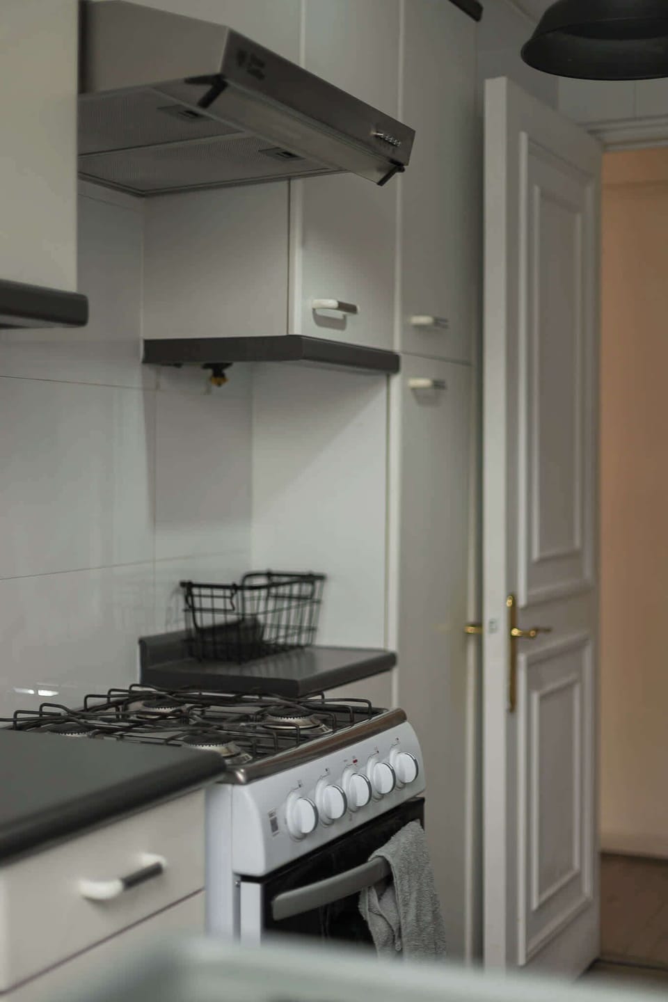 Cozy kitchen with modern appliances and ample storage, perfect for preparing meals during your stay.
