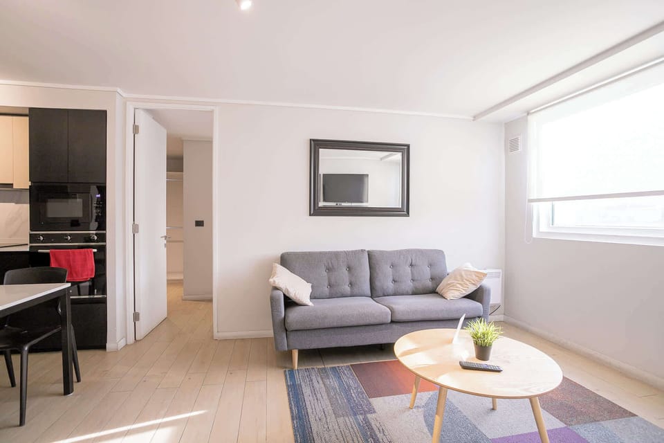 Bright and cozy living area with modern decor, perfect for relaxing after exploring the city.