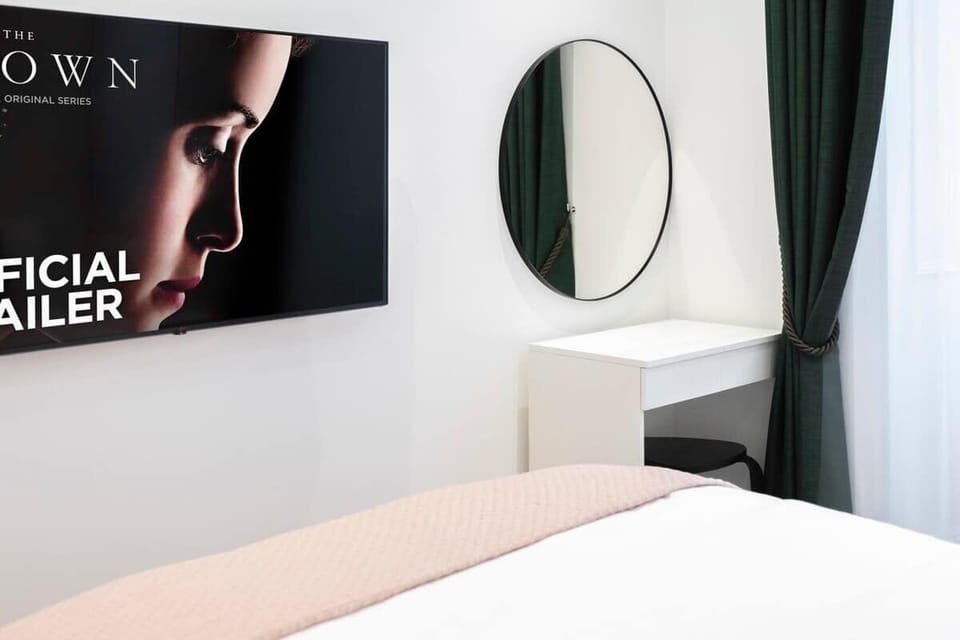 Bedroom 2 | Elegant bedroom, boasting a lavish king-size bed, advanced air conditioning, a sleek 50-inch smart TV, and a chic dresser for your convenience.
