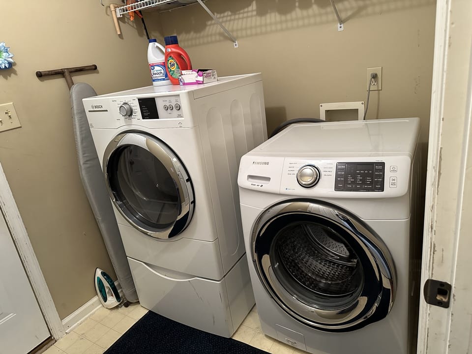 Laundry Room with Washer and Dryer, Ironing Board and Iron