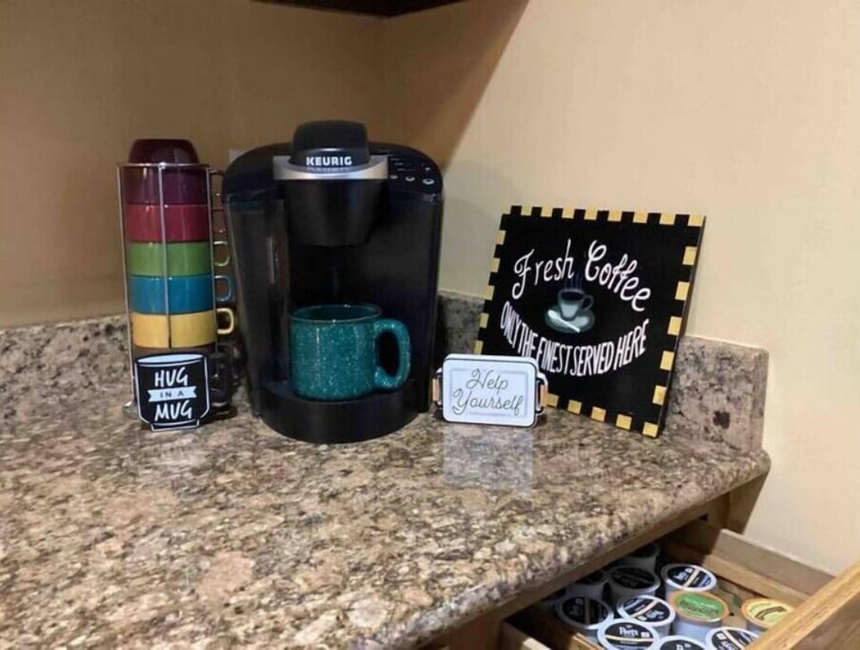 Keurig coffee maker & 4 cup drip maker under counter. Coffee and tea provided. 
