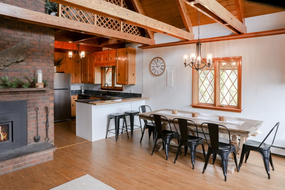The modest kitchen and dining table with seating for up to 10.