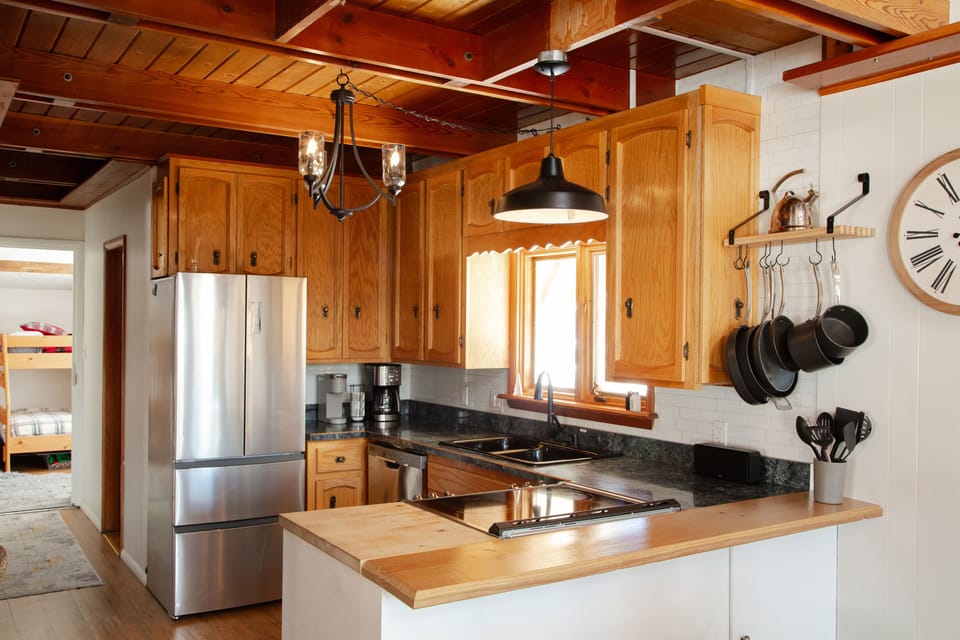 Fully stocked kitchen with glass top stove and dual oven 