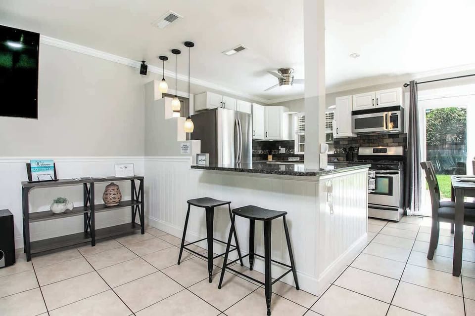 Barstools looking into kitchen area.
