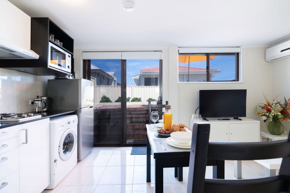 Kitchen:Cooktop/microwave/fridge and washing machine.