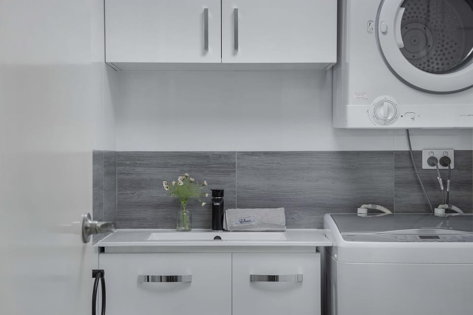 Laundry with washer and dryer. Clean and convenient laundry area for your stay.