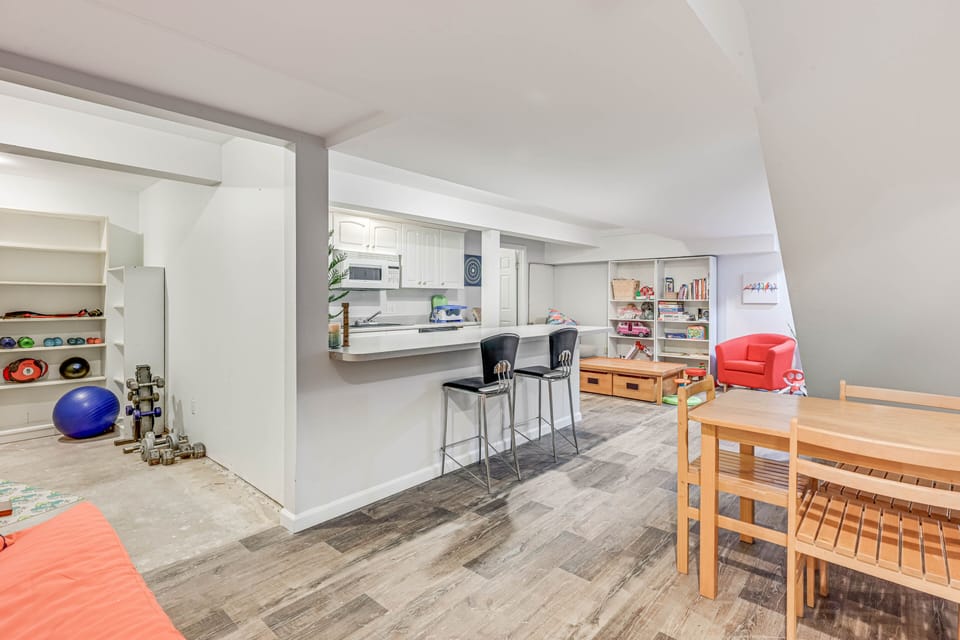 Lower level rec room. Second kitchen. Game table. Kids toys.