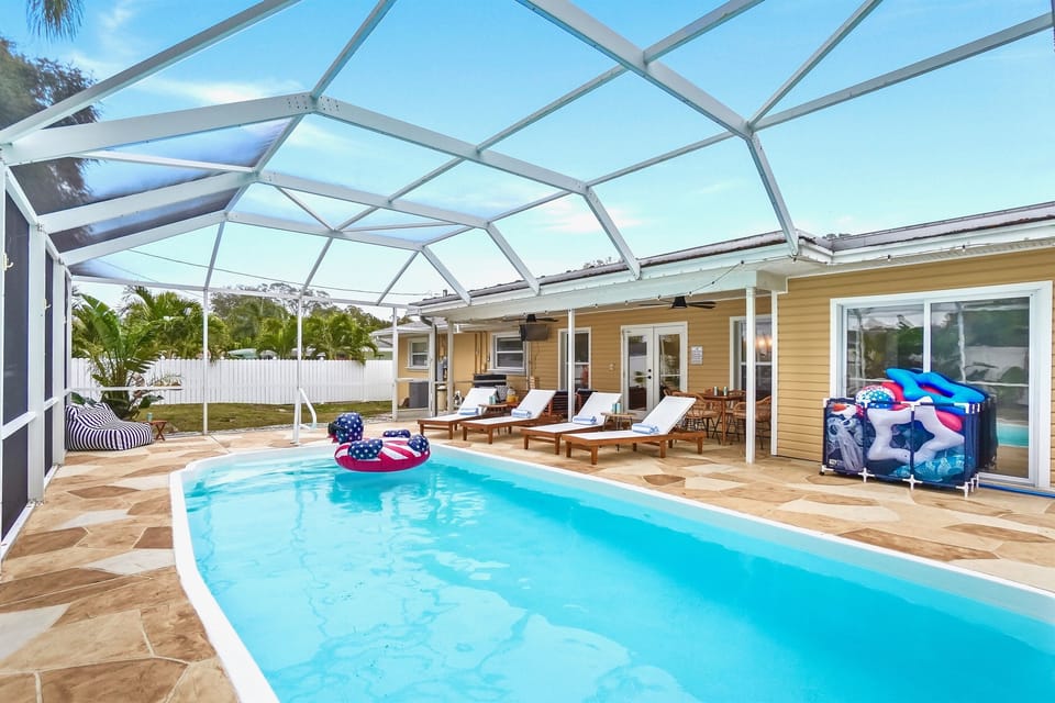 Relax in the enclosed lanai with both shaded and sun-soaked seating, the perfect spot to sip coffee poolside in the morning or unwind after a day at Clearwater Beach.