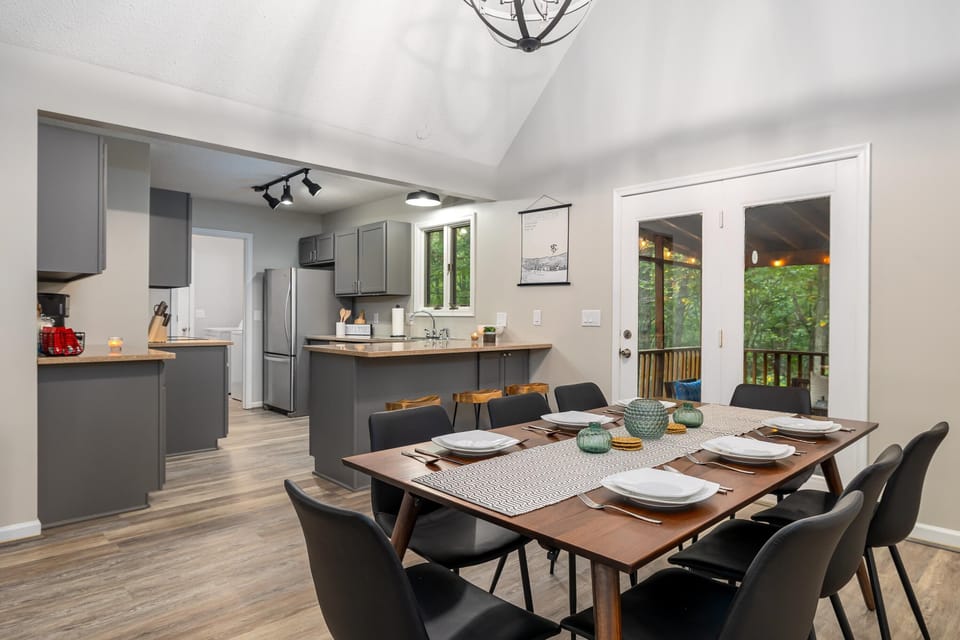 The kitchen is next to the expandable dining table