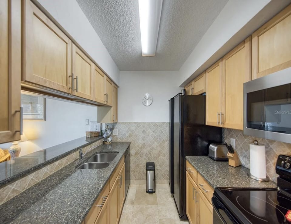 Fully Equipped Kitchen with Stainless Steel Appliances