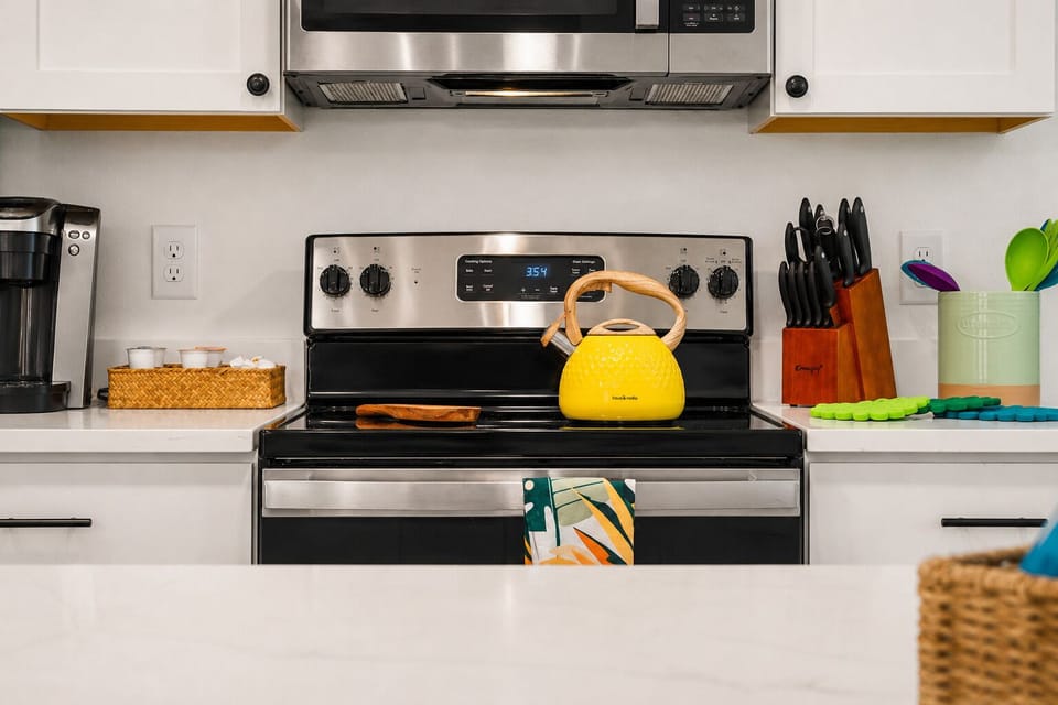Stainless range and full counter space for cooking meals for the group