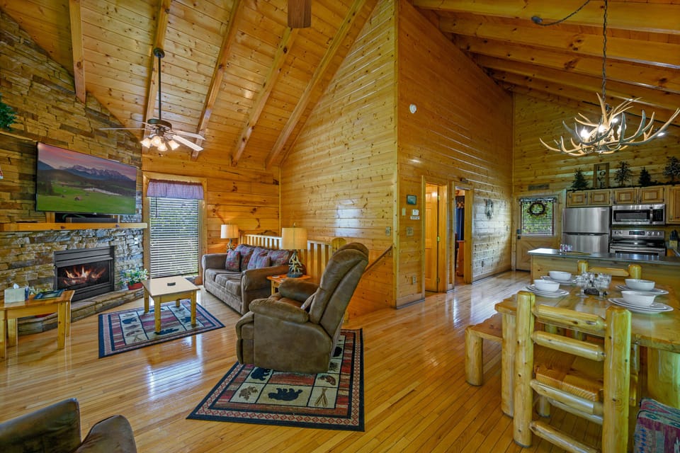 Enjoy the warm company of family or friends with forest views by the fire