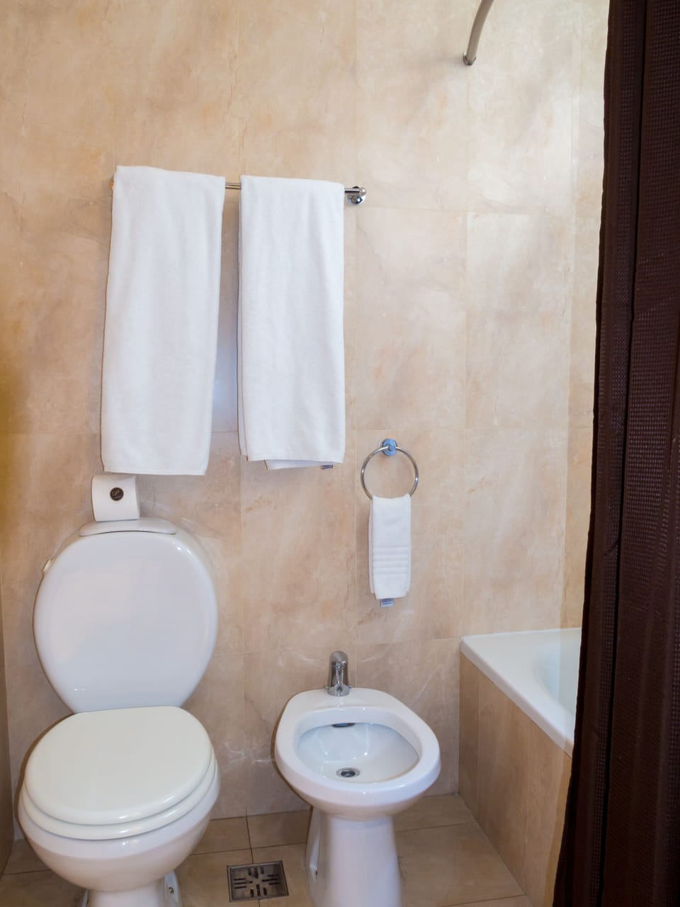 Get comfortable for a bath, with a bidet and towel rail also close at hand.