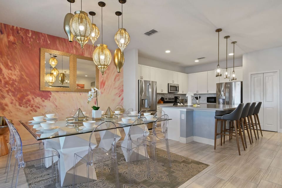 Stunning dining space with chic lighting, open kitchen, and style