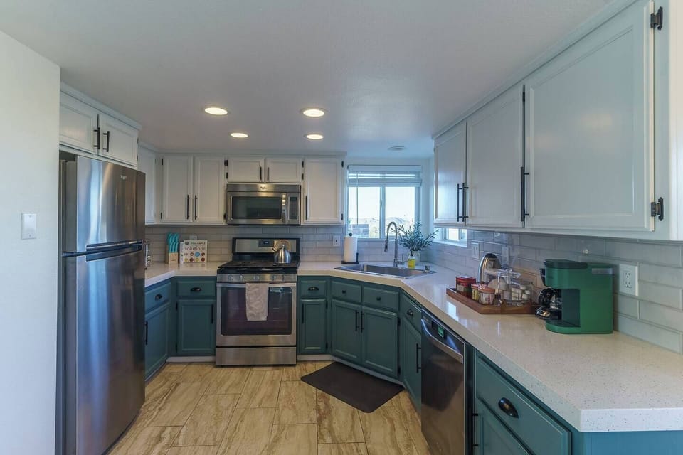 Full kitchen with gas stove and oven, microwave, full sized refrigerator.