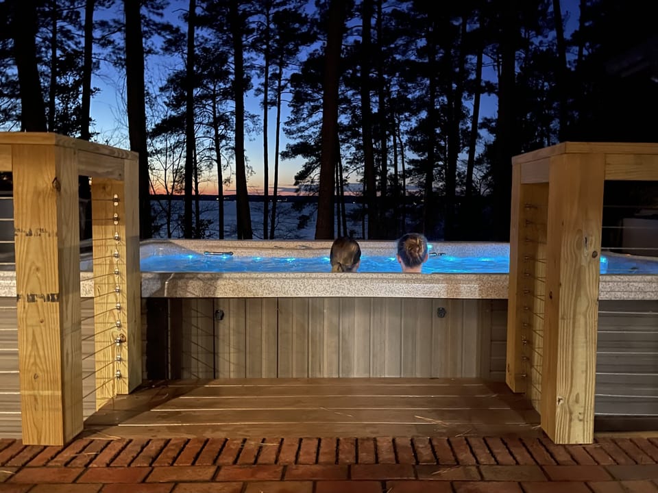 Hot tub with lake view.