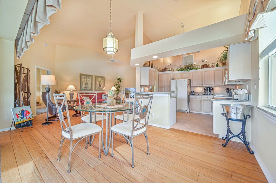 BF201 - Dining for four off the kitchen. Sliding doors open up to the oversized balcony with lake and golf course view
