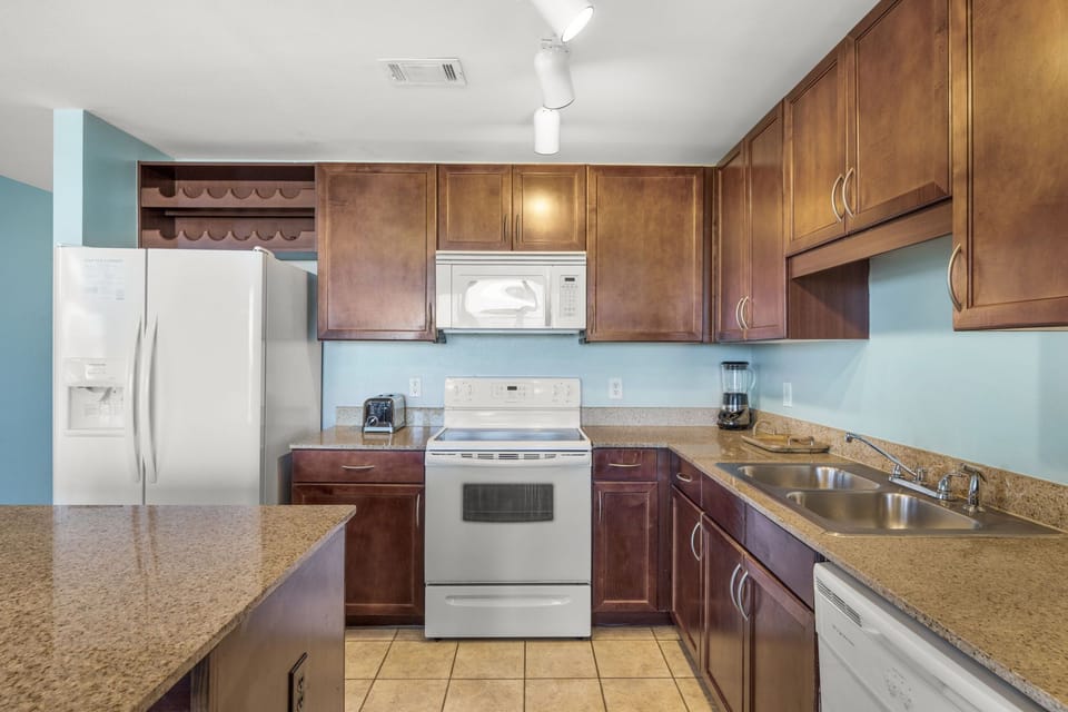modern kitchen with wooden cabinets and granite countertops