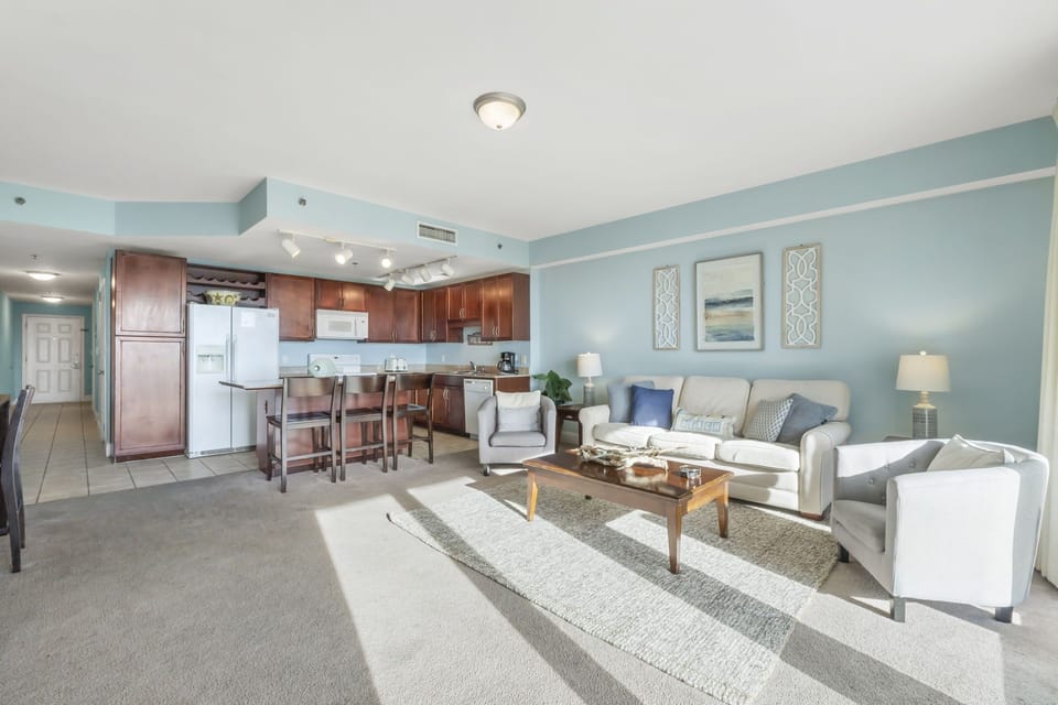 Open-concept living area with a modern kitchen and comfortable seating.