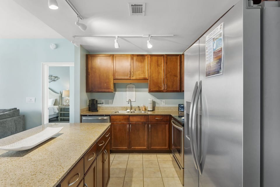 Modern kitchen with stainless steel appliances and wooden cabinetry