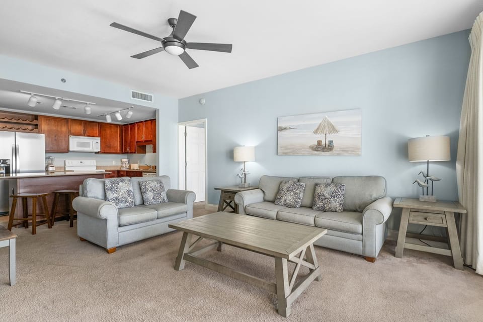 Relax in this cozy living room with soft blue walls and comfortable seating.