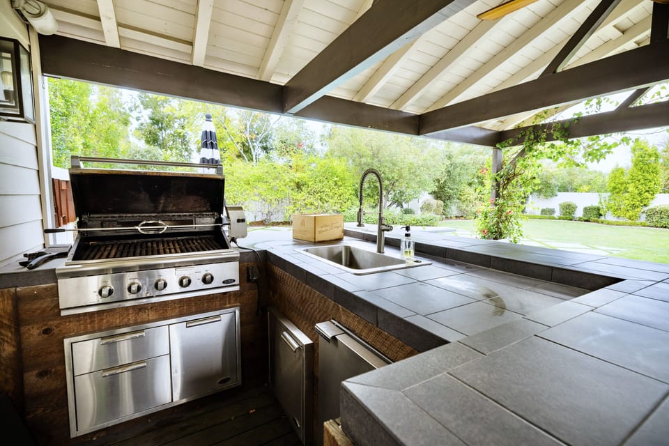 Covered outdoor kitchen and bar area
