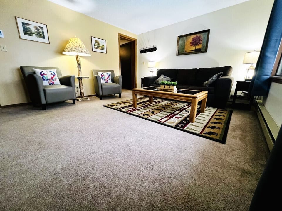 Living room is equipped with a Queen Size sofa sleeper and additional arm chairs for seating for your stay.