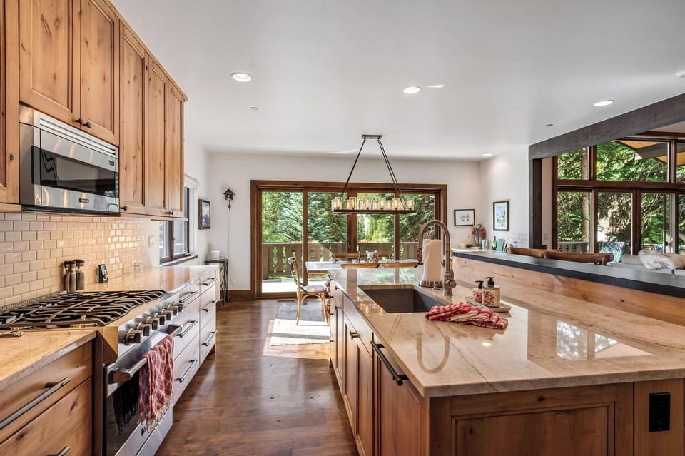 Pristine kitchen with gas range and ample storage. The perfect space for a private chef experience.