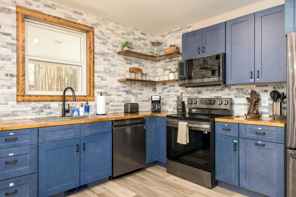 Start your day at the coffee bar - drip brewer, electric kettle, and lake views included.