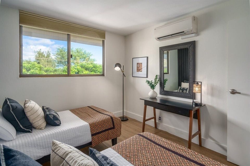 Our bright and airy second bedroom with comfy twin beds is perfect for sharing.