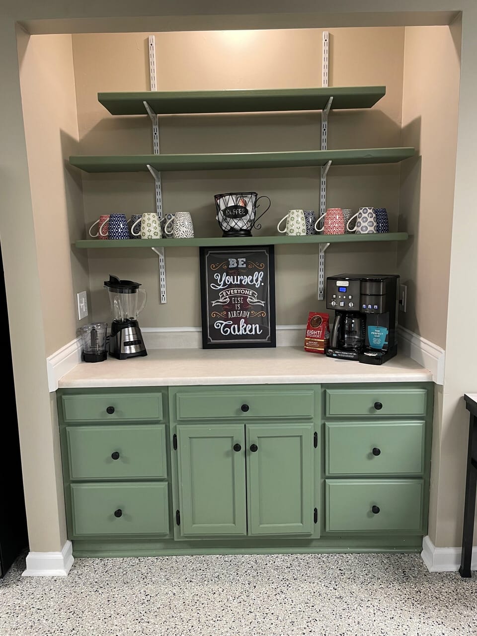 Coffee/beverage bar next to a second refigerator. Cuisinart coffee single or pot