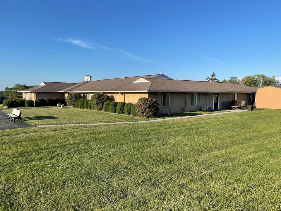 Property sits on 8 acres with lots of parking and grassy area to play.