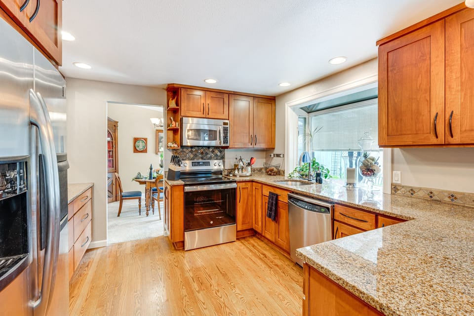 Kitchen with microwave, oven/stove, dishwasher, refrigerator. & garbage disposal