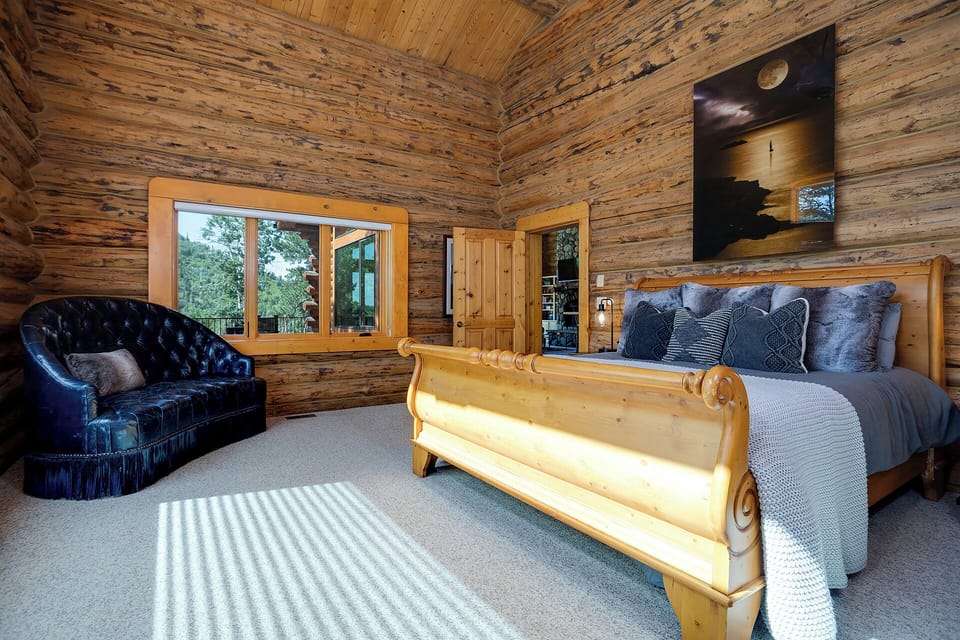 Primary bedroom with King bed and seating are