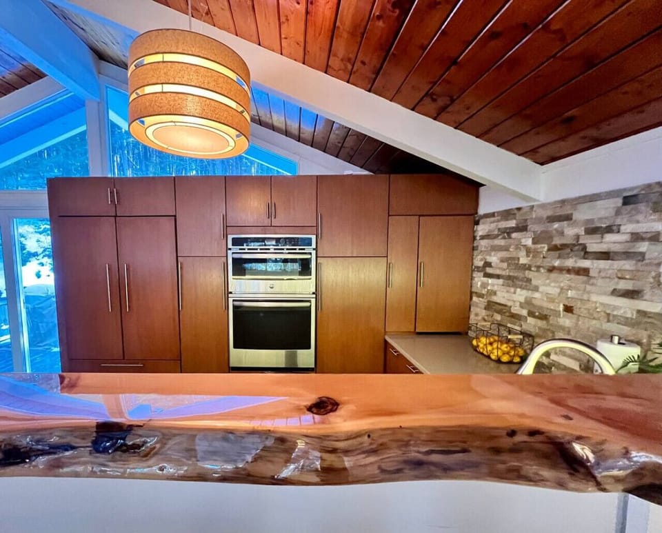 Culinary convenience: explore our well-equipped kitchen with cabinetry and GE Double Wall Oven!