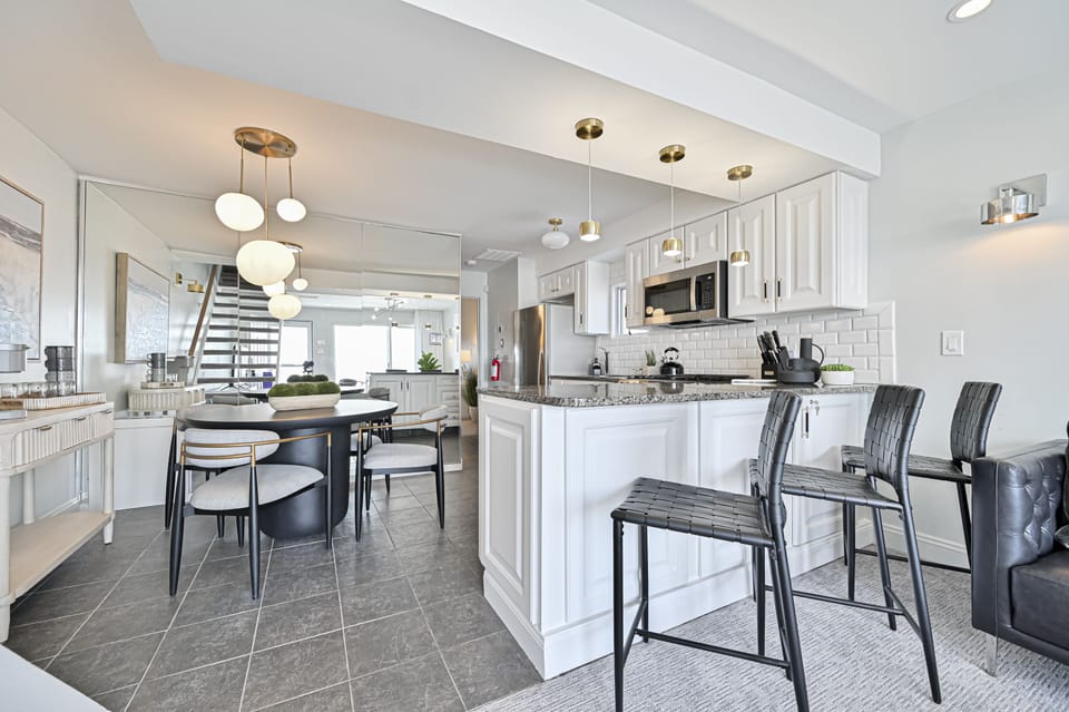 "Modern kitchen, fully equipped to comfortably seat 8."