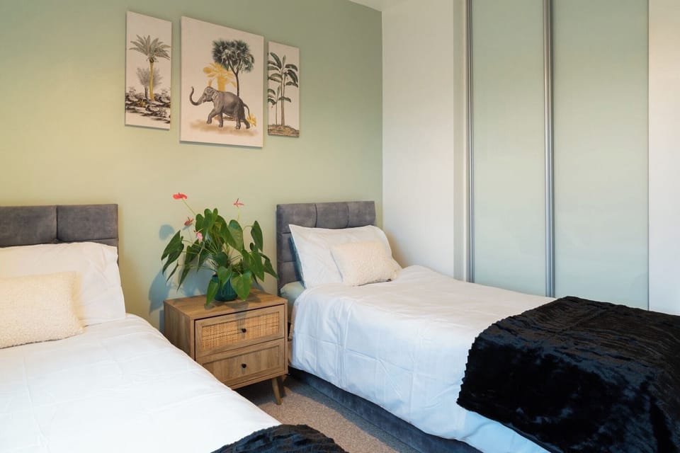 Bedroom Two offers two comfortable single beds, a spacious wardrobe for storage, and calming waterside canal views. It’s a bright, peaceful room perfect for friends, families, or extra guests wanting a relaxing night’s sleep.