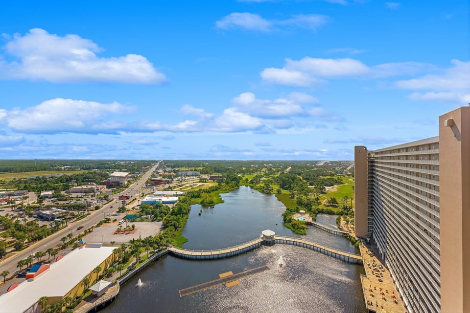 View of the river and surrounding cityscape from a high-rise balcony