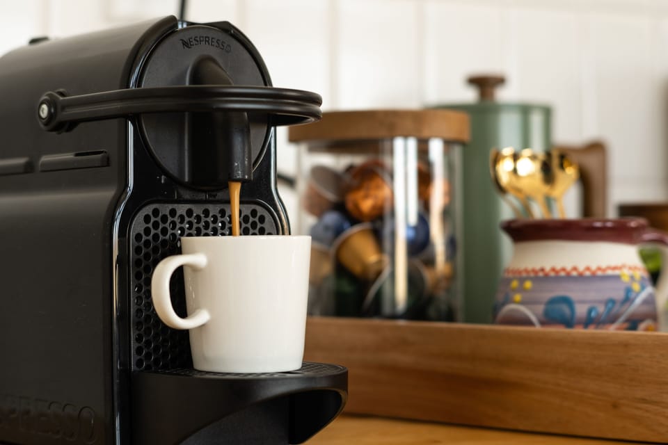 Start your day right with some complimentary espresso or coffee.