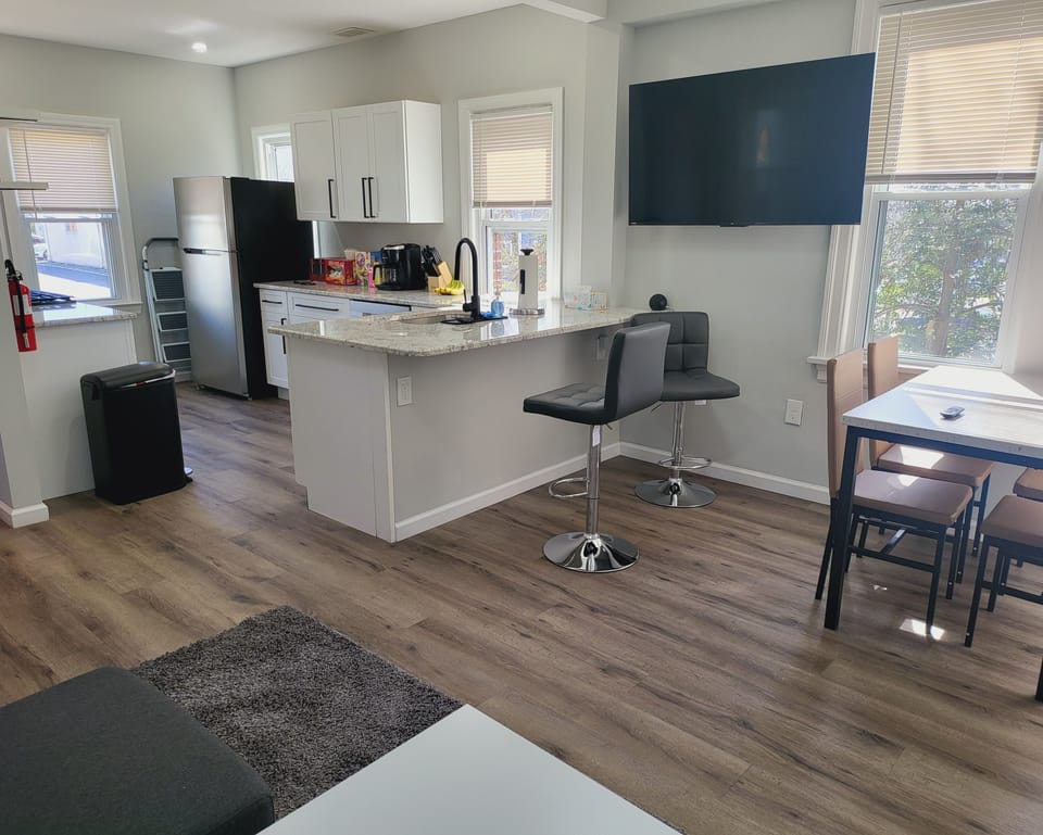 View of the dining area and kitchen from the sofa bed