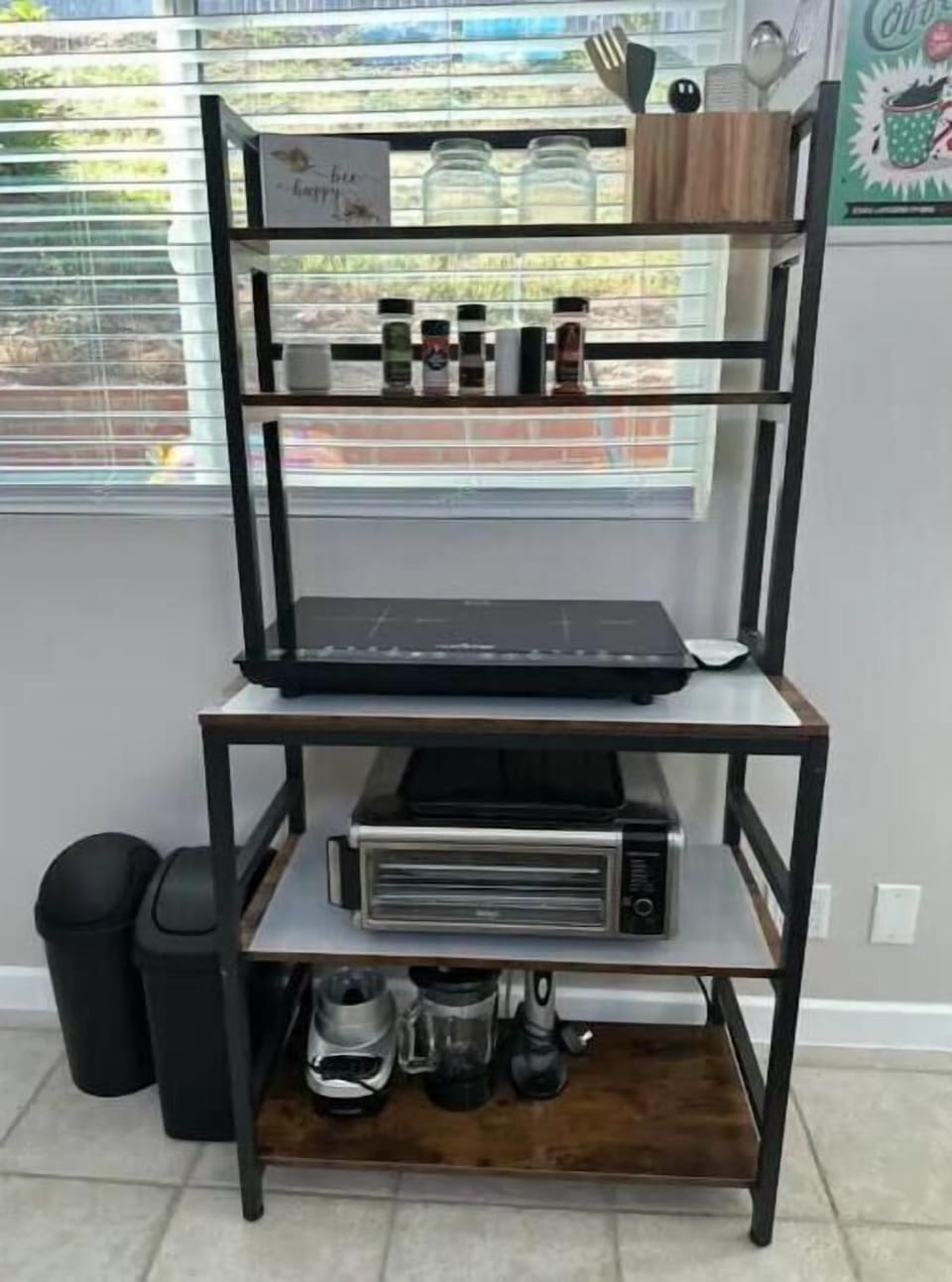 Food prep space with utensils, seasonings, oven/air fryer combo, Induction stove