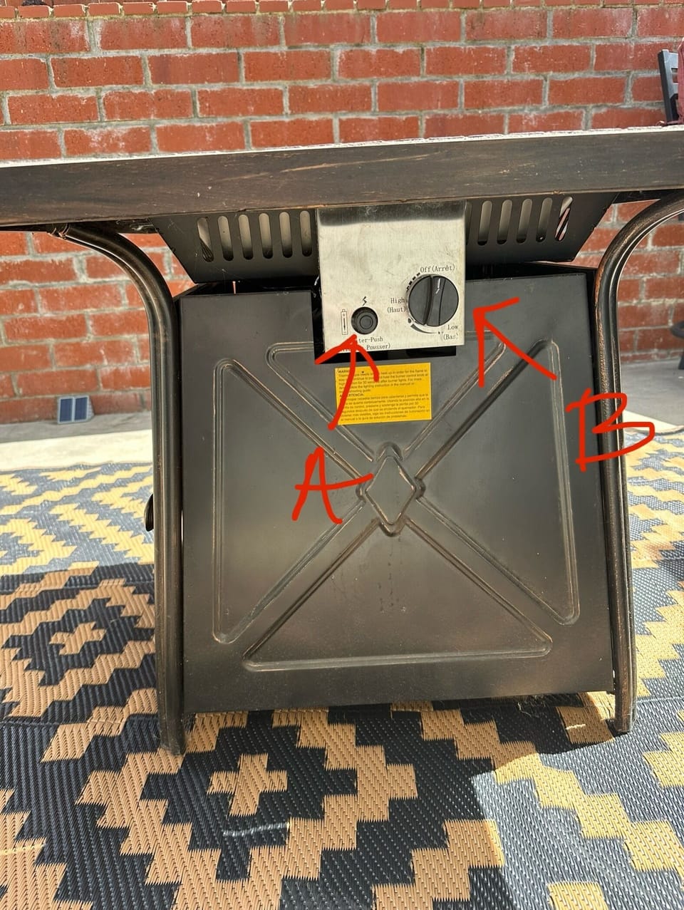 3. Push and hold A while turning B until fire pit ignites. Release B 