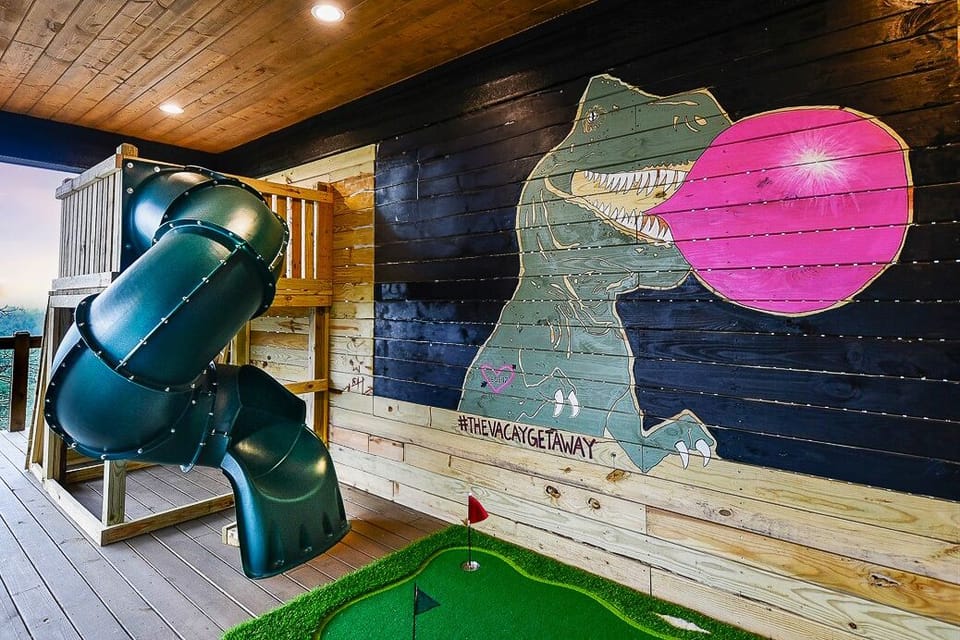 Be LEGENDARY and take a photo with our dinosaur mural on the lower level deck. Slide, rock wall, putt putt, games, lounge, flat screen, and more!