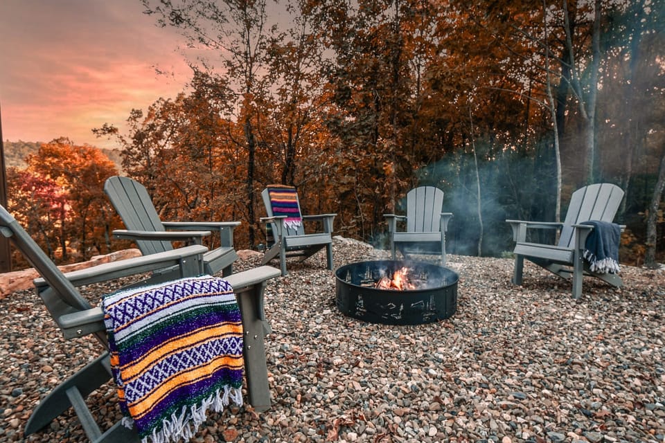 Fireside chats and peaceful sunset views from our wood burning firepit and premium Adirondack chairs!